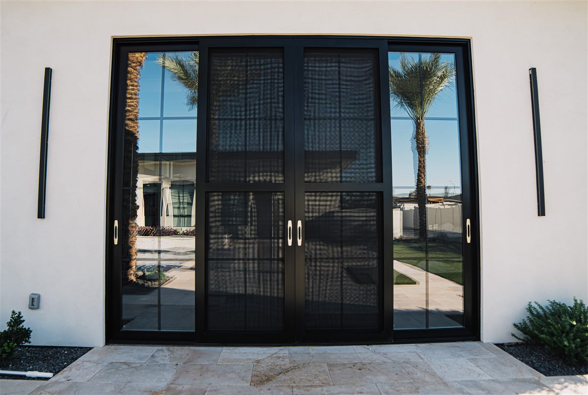 Aluminum multi-slide patio door opening to a pool