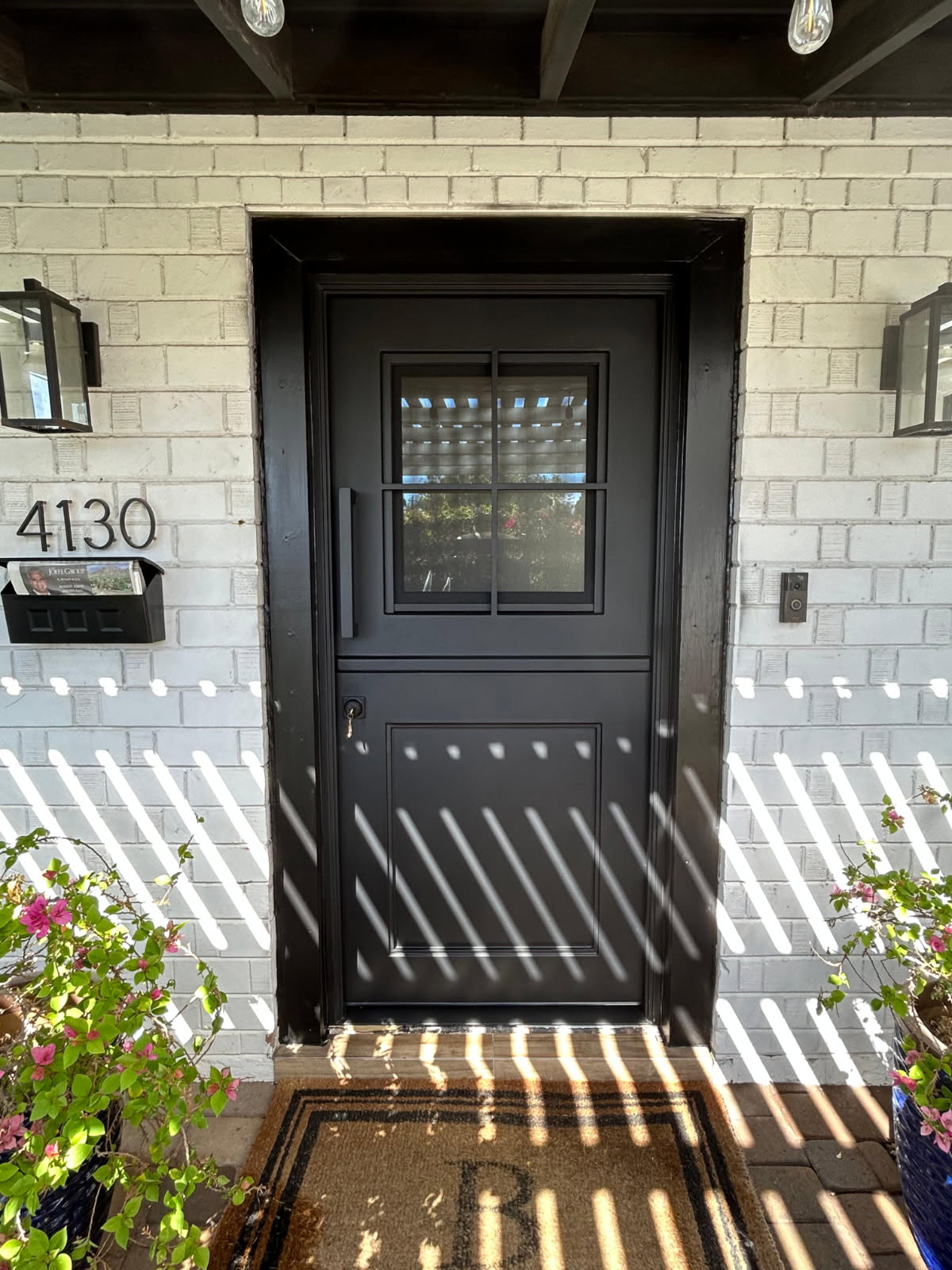 Iron Dutch door with stone surround