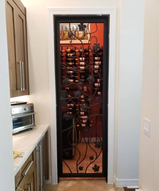 Decorative iron and glass wine cellar door
